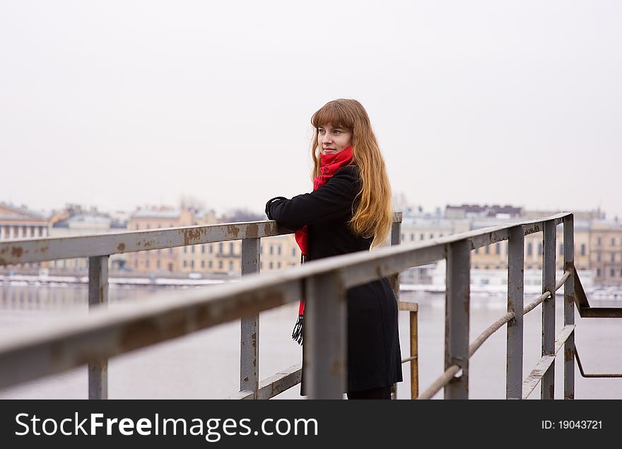 Young Girl Standing On Iron Bridg