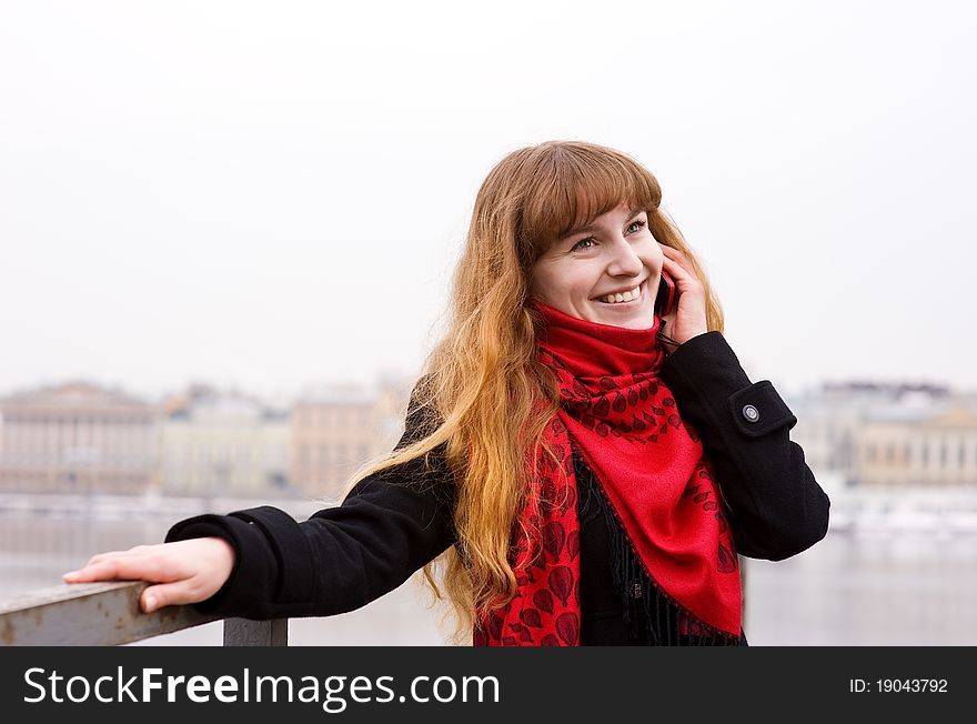 Young Girl In The Red Scarf Calling On Phone