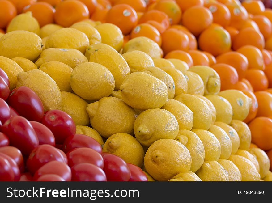 View of fruits and vegetables sitting on a street market's table.