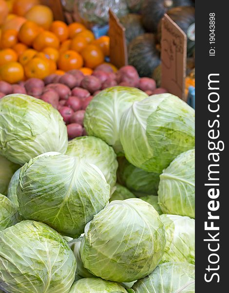 View of fruits and vegetables sitting on a street market's table.