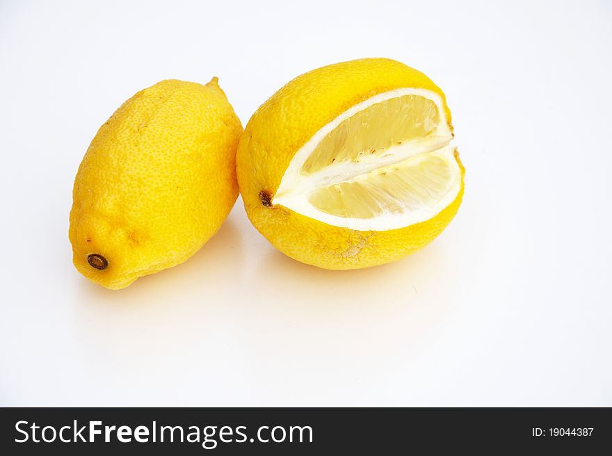 Two lemon isolated on white.