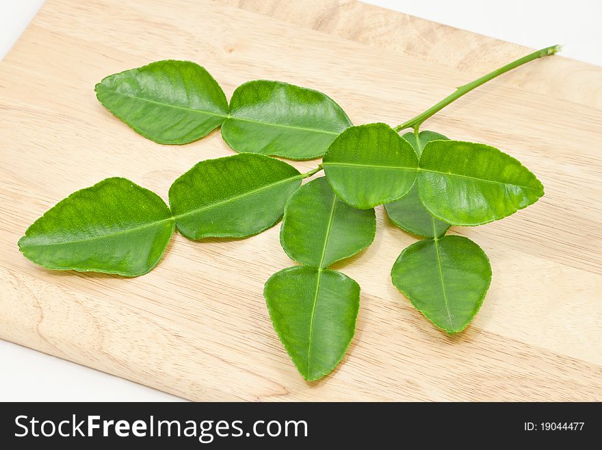 Kaffir lime leaf on wood cut board