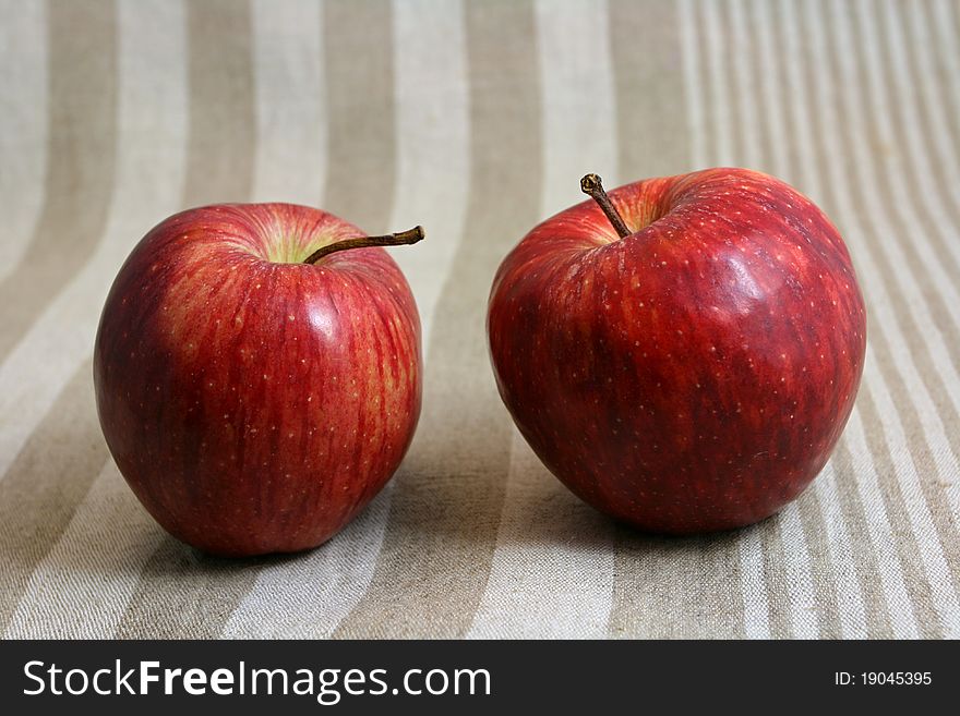 Two apples on linen napkin