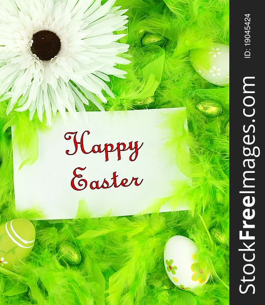 Easter greeting card on green feathers