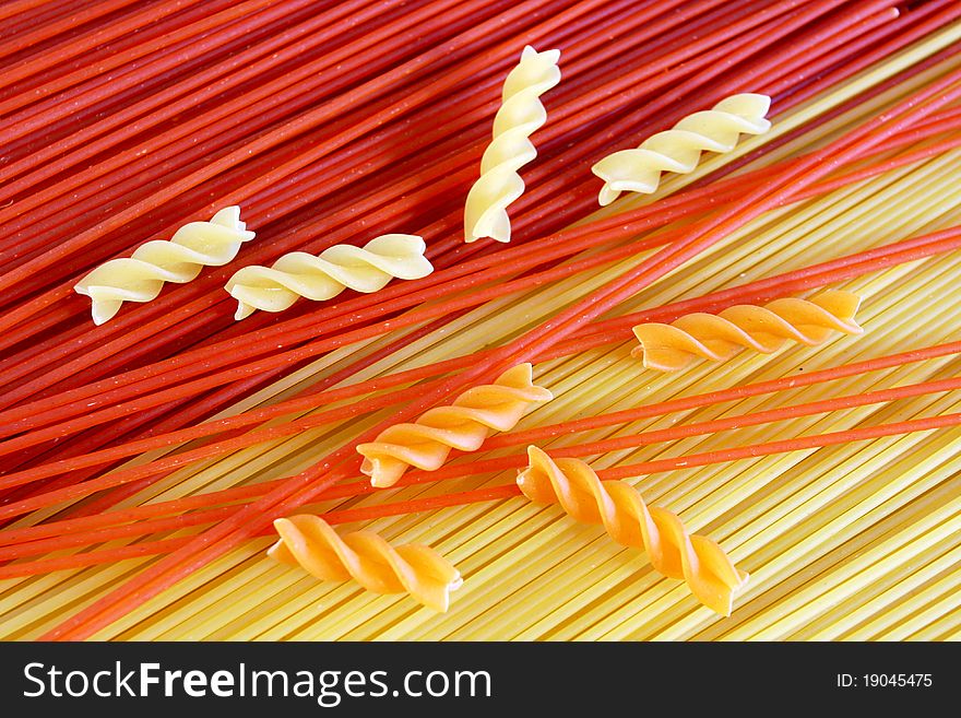Background - red and yellow spaghetti, fusilli