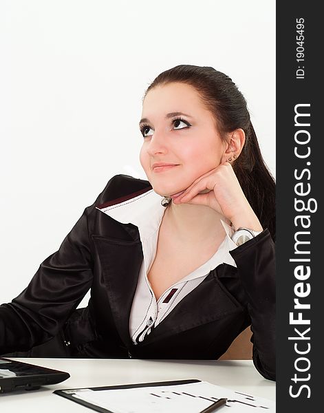 Beautiful woman in a black business suit with a white