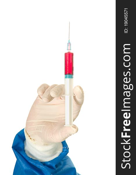 Hand of a  surgeon holding a syringe