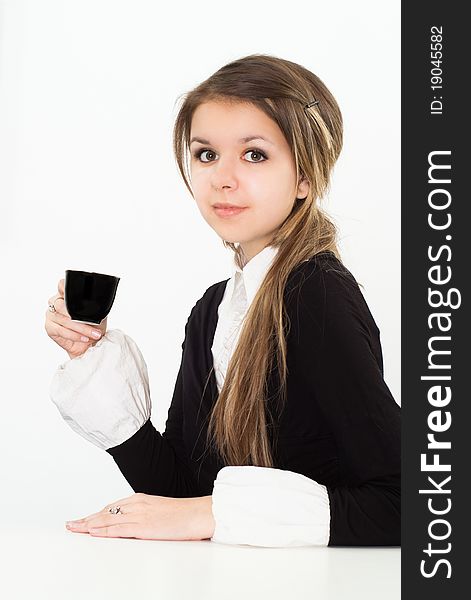 Beautiful woman drink in a black business suit with a white