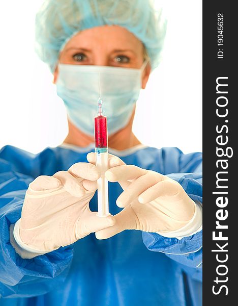 Woman surgeon holding a syringe in white background