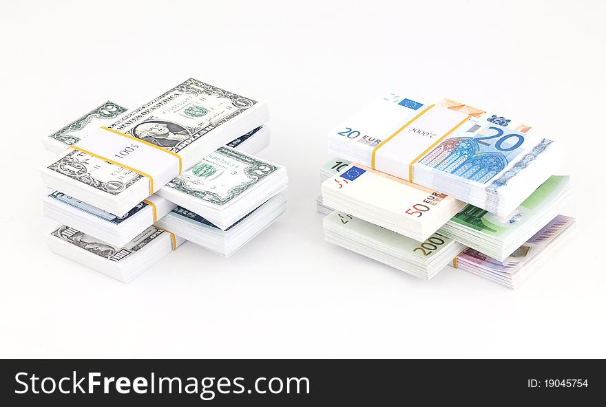 Stacks of dollars and euros. Stacks of dollars and euros