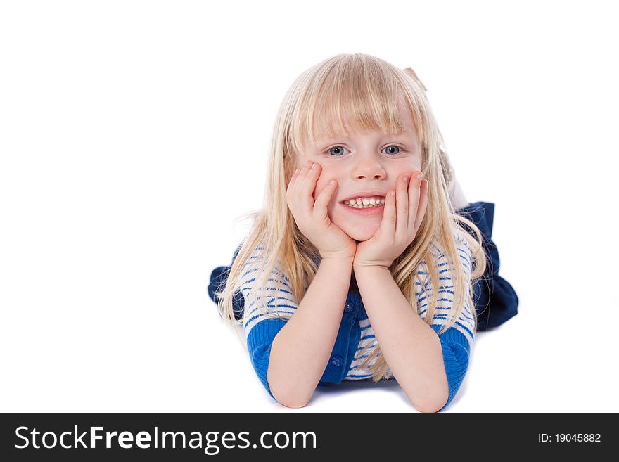 Happy smiling little girl lie looking at camera