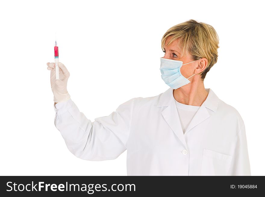 Female doctor with mask holding a syringe in white background