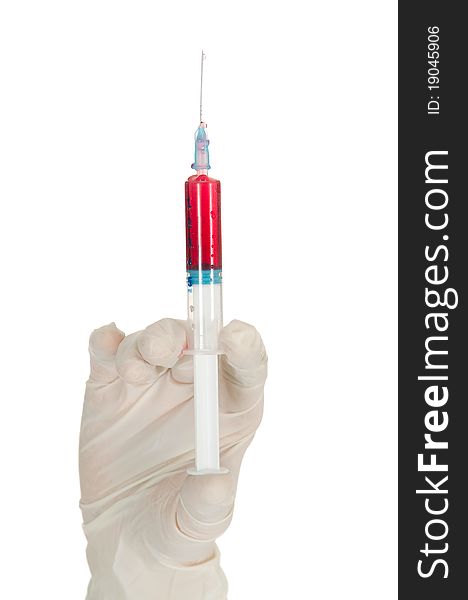 Hand holding a syringe in white background