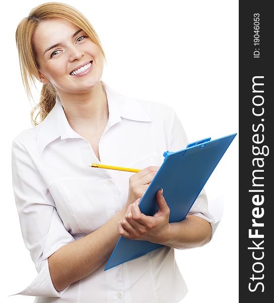 Young pretty woman standing and holding blue tablet with pencil