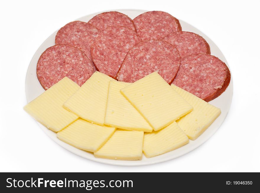 Sliced sausage and cheese on white