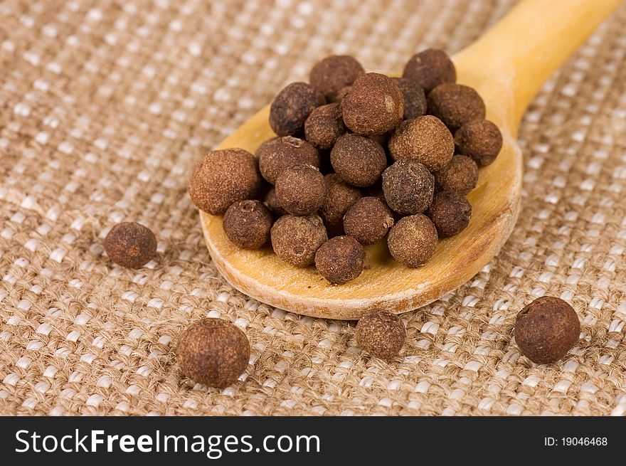 Fragrant Peppercorns On A Wooden Spoon