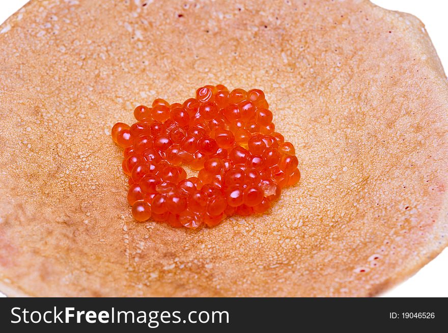 Pancakes with caviar against white background