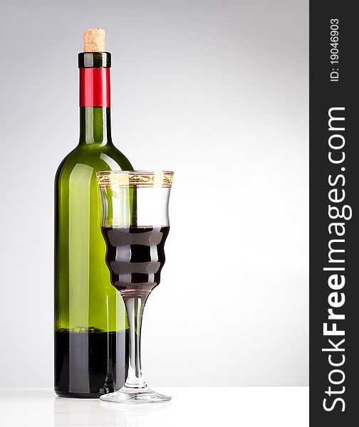 Wine bottle and wineglass