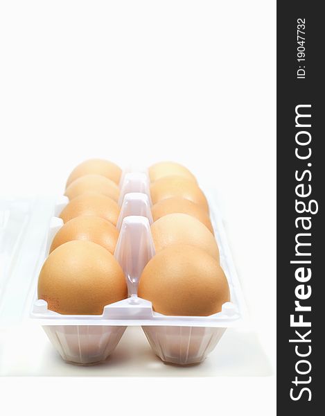 Eggs in egg tray on seamless background in shallow depth of field. Eggs in egg tray on seamless background in shallow depth of field.