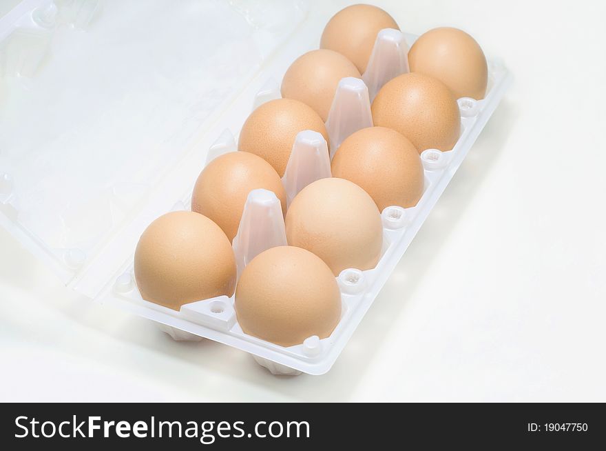 Top view of fresh grade A eggs in egg tray. Top view of fresh grade A eggs in egg tray.