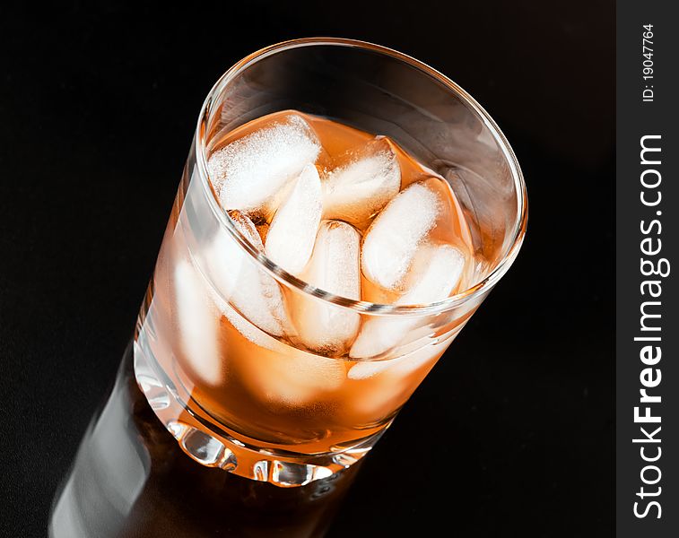 Glass of whisky with ice. Glass of whisky with ice