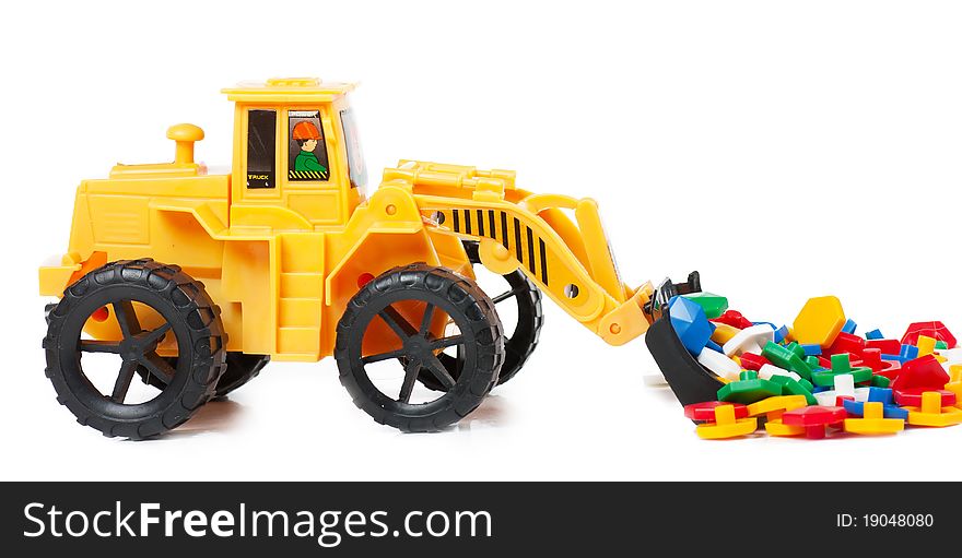 A small replica of an excavator. Isolated on a white background.