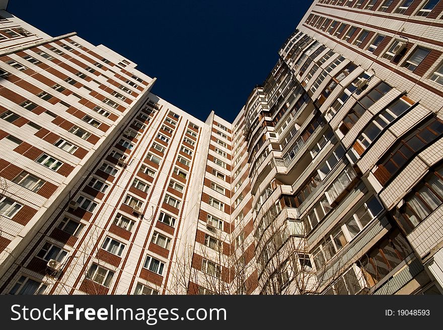 Dwelling house view in Moscow with lots of windows and balconies.