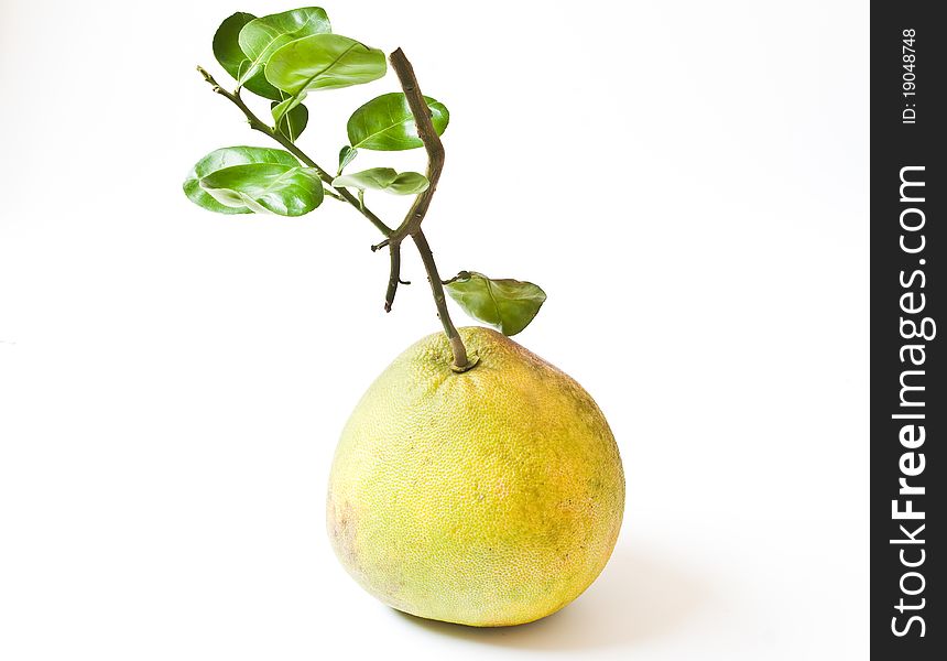 Pomelo fruit with leaves isolated on white background