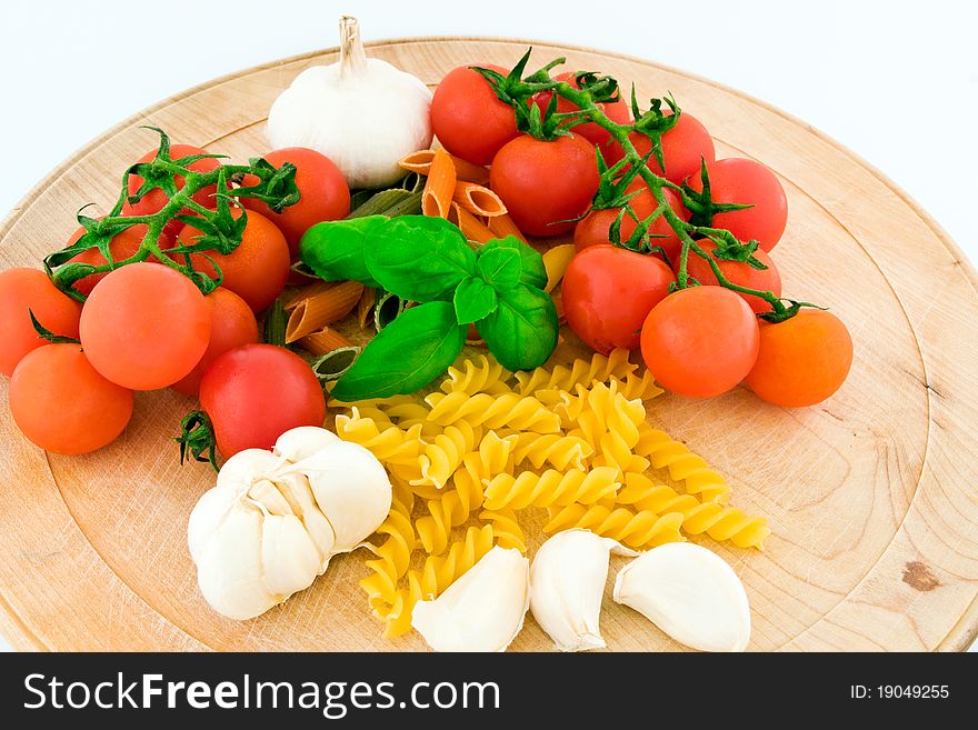 Composition of pasta, tomato, basil and garlic. Composition of pasta, tomato, basil and garlic