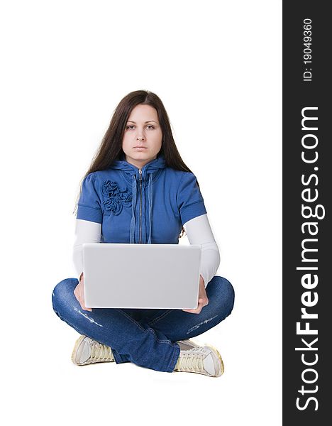 Girl sitting on the floor on her hands computer. Girl sitting on the floor on her hands computer