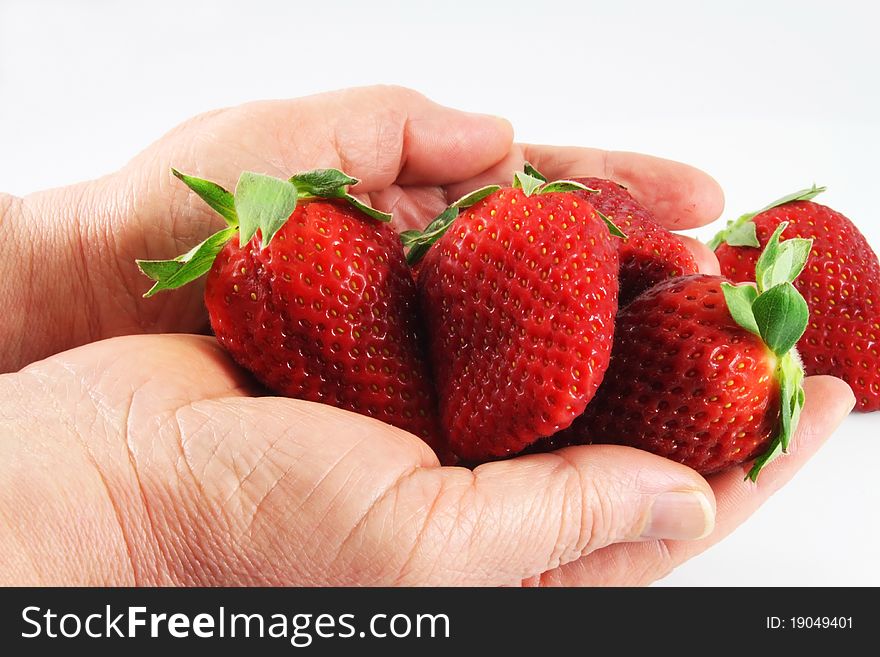 Strawberry in hand close-up