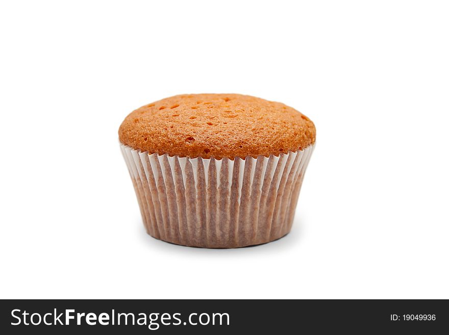 One cake in paper packing isolated on white