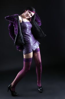 Young Girl In Purple Fur Coat And Gothic Make-up Royalty Free Stock Photo