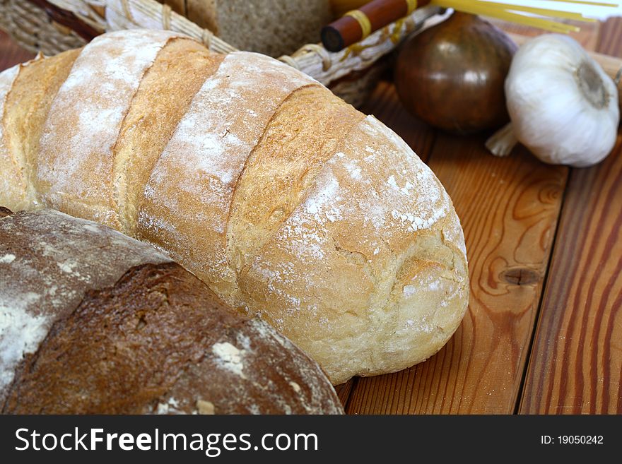 Assortment of baked bread on a wooden table