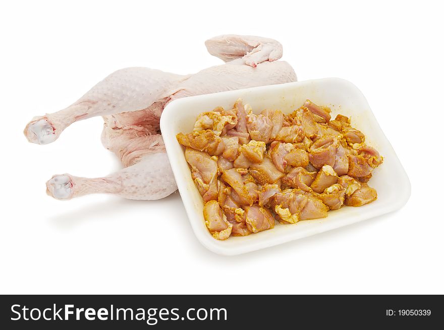 Marinated chicken and fresh chicken isolated on white background