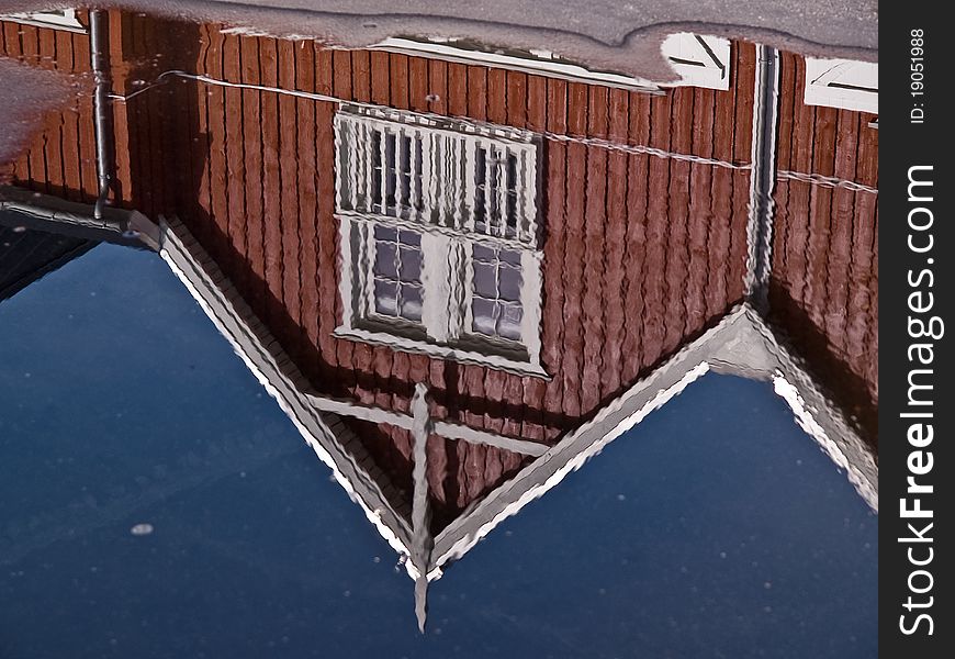 Modern classical design beach summer houses reflected perfectly in a small water pond. Modern classical design beach summer houses reflected perfectly in a small water pond