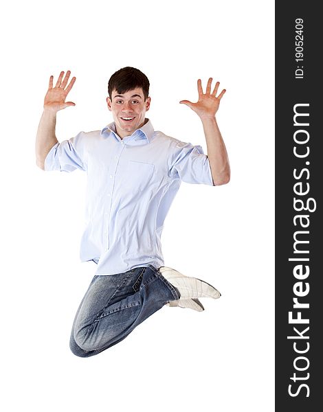 Young dynamic sportive man jumps high in the air.Isolated on white background.