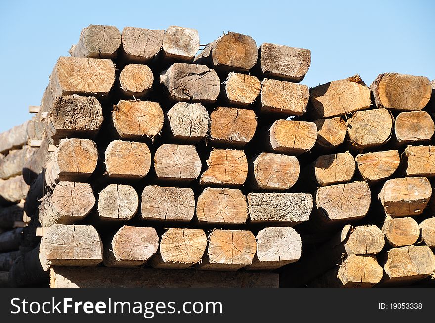 Piled up construction timber seen as facewood