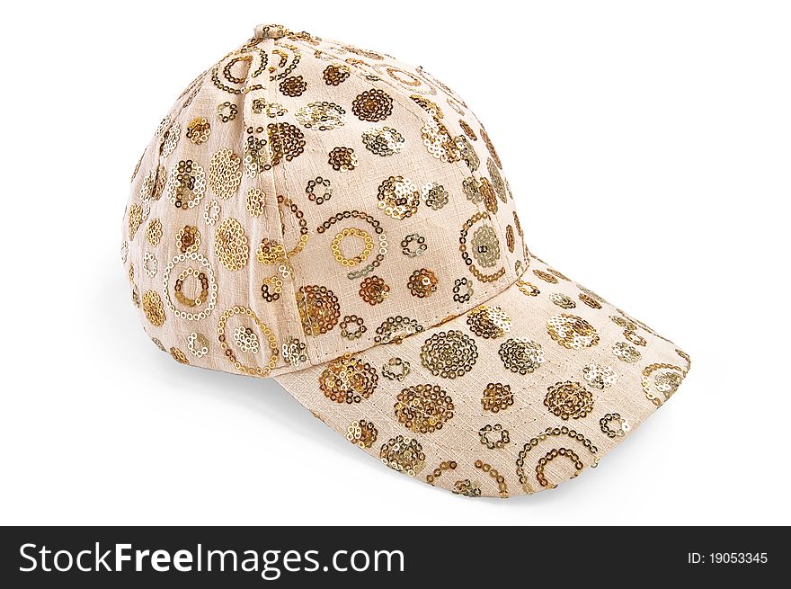 Beige cap with the pattern with a light shadow on a white background. Beige cap with the pattern with a light shadow on a white background