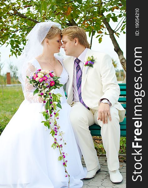 Bride and groom hugging outdoor