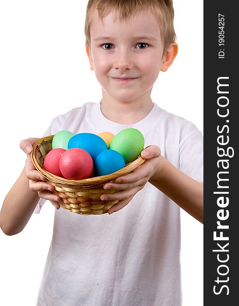 Boy with a basket with Easter eggs on a white background. Boy with a basket with Easter eggs on a white background