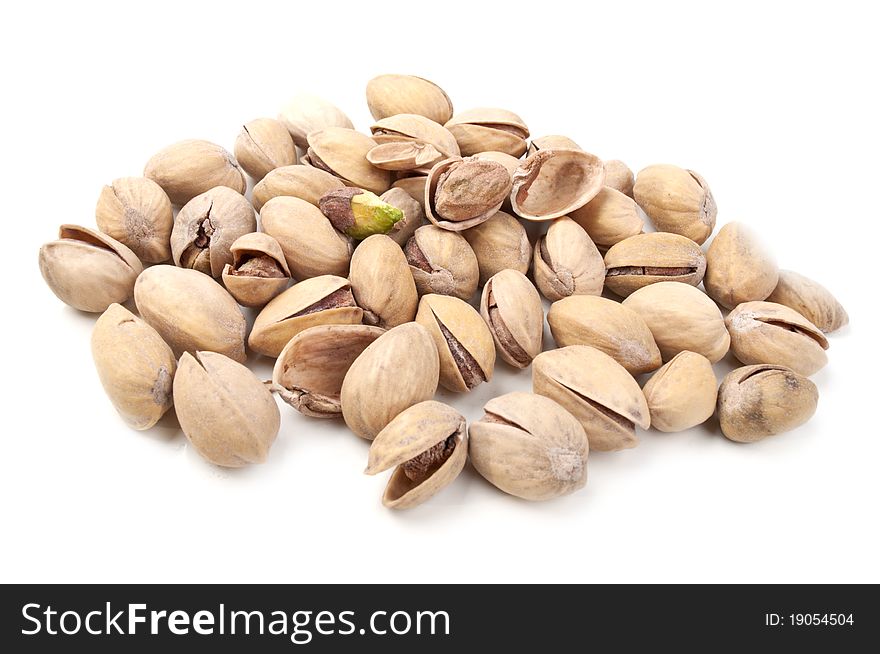 Many pistachios isolated on a white background