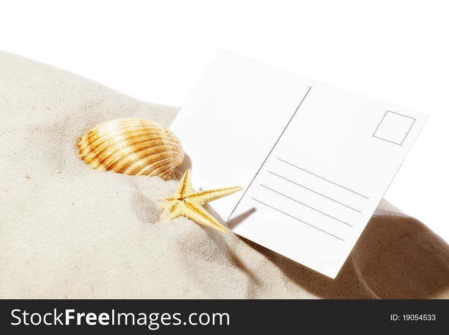 Beach concept with seashell ,starfish and a blank card with copy-space.Focus on card. Beach concept with seashell ,starfish and a blank card with copy-space.Focus on card