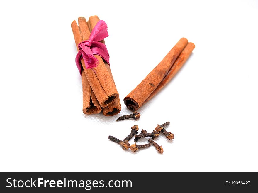 Photo of cinnamon and carnation on a white background