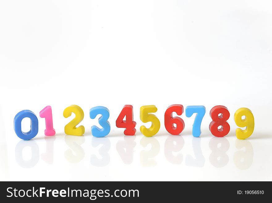 Plastic toy numbers isolated on white