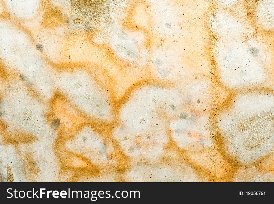 Grunge background of smudges, cracks and speckles