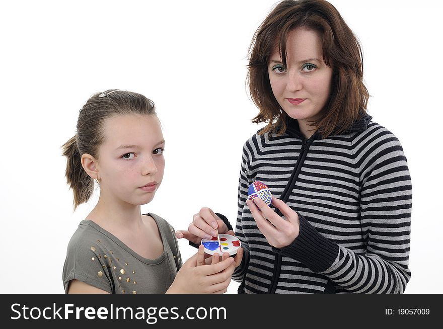 Two white persons creating easter traditional eggs. Two white persons creating easter traditional eggs