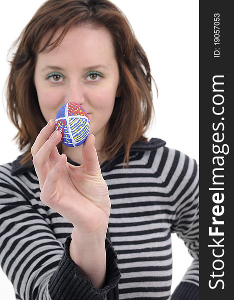 Young woman creating traditional easter eggs. Young woman creating traditional easter eggs