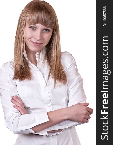 The beautiful girl in a white blouse on a white background close. The beautiful girl in a white blouse on a white background close