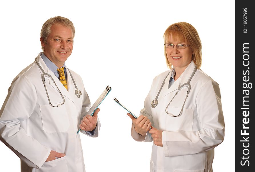A couple of Doctors with clipboards. A couple of Doctors with clipboards